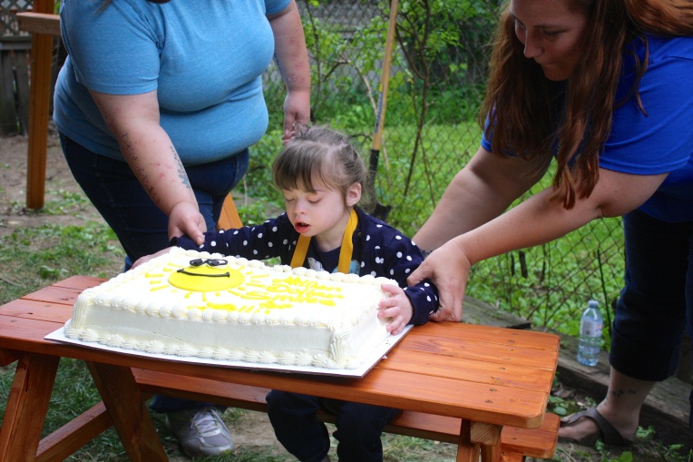 One more minute and this cake may have ended up on the ground - this bug is totally into throwing everything!